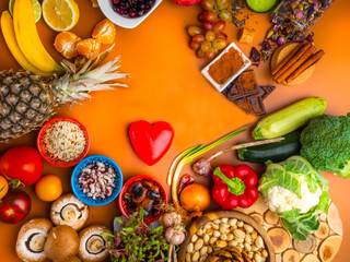 Mixed colorful foods as nuts, fruits, vegetables, beans, herbs, powders, contains antioxidants, vitamins, fiber. Immune boosting products. Healthy clean concept. Superfoods