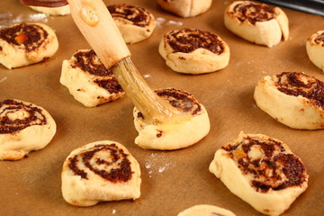 Brushing with egg glaze. Making Poppy Seed Snail. Sweet Roll Bun.