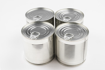 Group of silver canned food on white background.