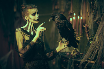 lady skeleton with black raven