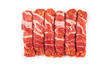 Chevapchichi in bacon isolated on white background.