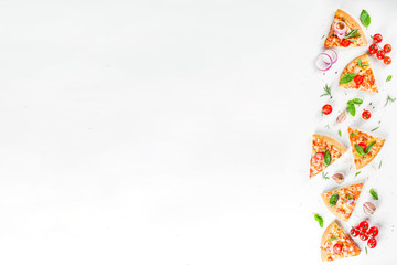 Pieces of cheese pizza Margarita with ingredients and herbs. White stone background top view