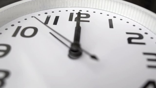 modern alarm clock is showing midday or midnight movement. It is twelve o'clock, holiday happy new year festive and christmas or lunch concept