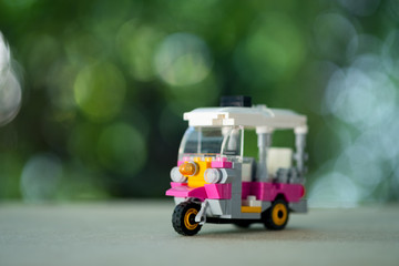 Pink Tuk Tuk toy car symbol Thailand