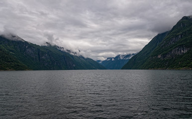 Obraz premium natural landscape at geirangerfjord in norway in summer cloudt day. July 2019