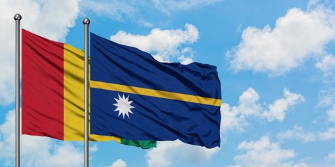 Guinea and Nauru flag waving in the wind against white cloudy blue sky together. Diplomacy concept, international relations.