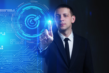 Business, Technology, Internet and network concept. Young businessman working on a virtual screen of the future and sees the inscription: