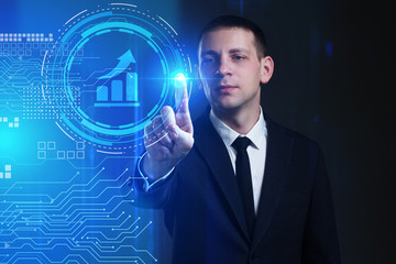 Business, Technology, Internet and network concept. Young businessman working on a virtual screen of the future and sees the inscription: