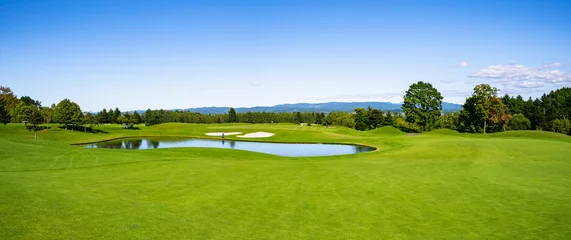 Foto op Plexiglas Golf Course with beautiful green field. Golf course with a rich green turf beautiful scenery. © okimo
