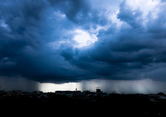 Naklejka na ściany i meble Storm cloud with heavy rain, lightning over city