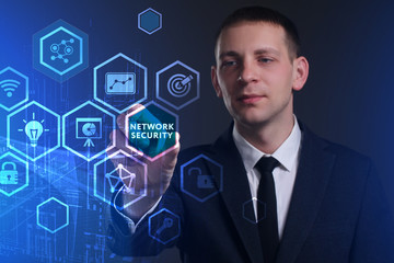 Business, Technology, Internet and network concept. Young businessman working on a virtual screen of the future and sees the inscription: Network security