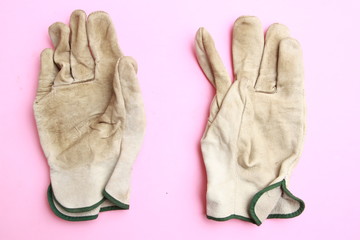 used leather work gloves in color background