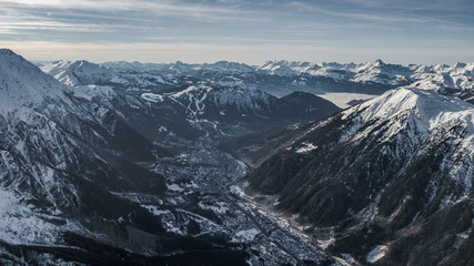 Aerial drone view of Chamonix city at the foot of snowy mountain Brevent