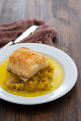 cod fish with sweet potato and olive oil on white dish