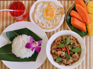 Rice topped with stir-fried minced pork and basil with Fried egg