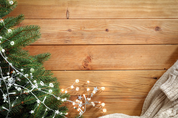 Flat lay background of free space for your decoration.Christmas composition and wooden desk.Winter cold day. Fir branches decoration.