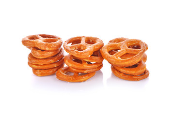 Salted pretzels on white background