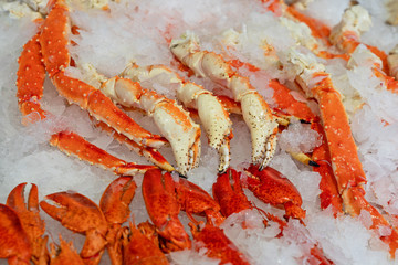 Crab legs sea food on ice background