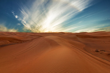 Fototapeta na wymiar Sand desert natural landscape, sunset sky dramatic view.