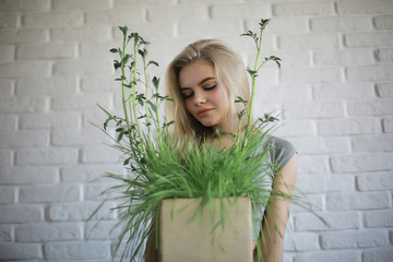 young adult blonde long hair at home, stylish model posing in the studio
