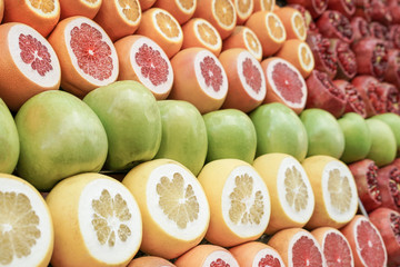 fruit background with pomegranate, apples and citrus