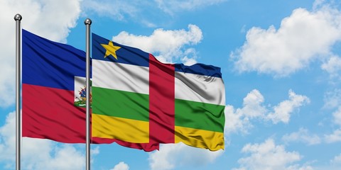 Haiti and Central African Republic flag waving in the wind against white cloudy blue sky together. Diplomacy concept, international relations.