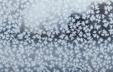  Texture of hoarfrost on the window. Frosty pattern on the glass.