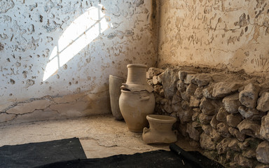 Clay jugs in the reconstructed building of the Byzantine era in the archaeological site Ancient Shiloh in Samaria region in Benjamin district, Israel - obrazy, fototapety, plakaty