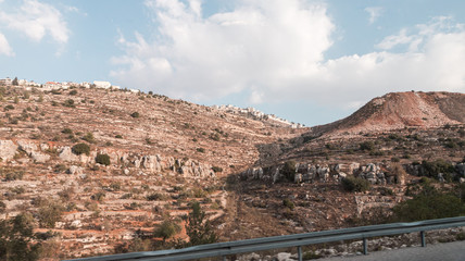 View from the highway number 5 to the Palestinian village Silwad located on a hill in Samaria region in Benjamin district, Israel - obrazy, fototapety, plakaty