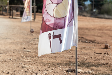 A flag with the name Dan - written in Hebrew - one of the tribes of Israel on the archaeological site Ancient Shiloh in Samaria region in Benjamin district, Israel - obrazy, fototapety, plakaty