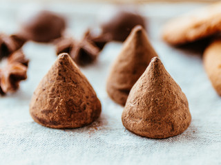 Truffels and cookies on linen background