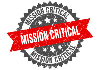 mission critical grunge stamp with red band. mission critical