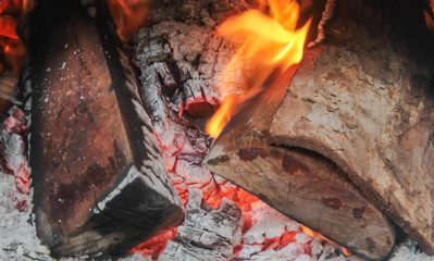 Burning fire wood log stove.