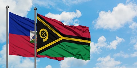 Haiti and Vanuatu flag waving in the wind against white cloudy blue sky together. Diplomacy concept, international relations.