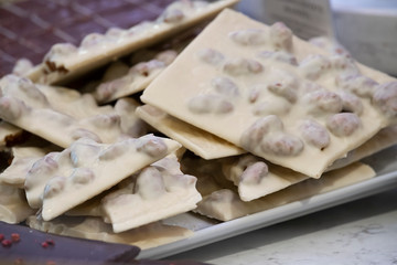 white chocolate bars with hazelnuts on the counter