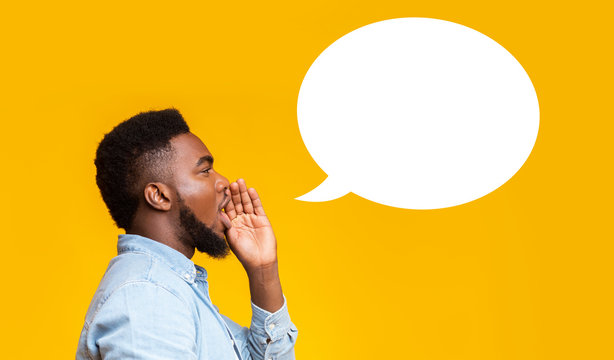 African american man making announcement at white blank speech bubble