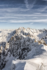 Plakat Skier hiker slowy walk down on a massive snow mountain slope on top of alps mont blanc