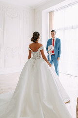 Modern ceremony in European style. Beautiful wedding couple in atmospheric forest with rocks.