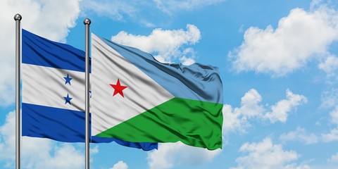 Honduras and Djibouti flag waving in the wind against white cloudy blue sky together. Diplomacy concept, international relations.
