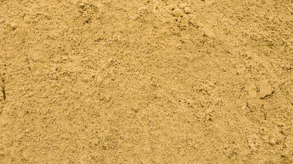 Yellow sand, backdrop texture. fine yellow beach sand in a sandbox