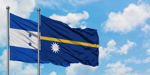 Honduras and Nauru flag waving in the wind against white cloudy blue sky together. Diplomacy...