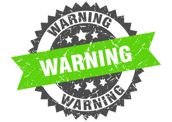 Obraz premium warning grunge stamp with green band. warning