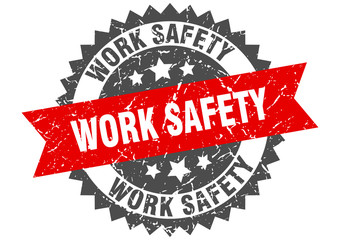work safety grunge stamp with red band. work safety