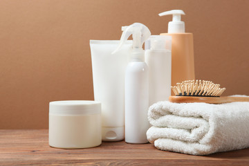 Obraz na płótnie Canvas hair care products and a comb on the table.
