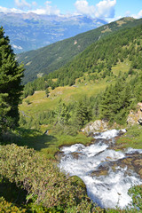 Naklejka na ściany i meble Waterfall in the Alps