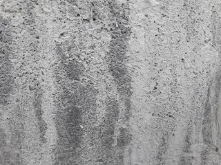 Gray cement walls are suitable for making a construction industry background.