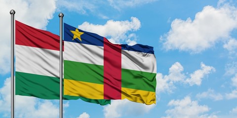 Hungary and Central African Republic flag waving in the wind against white cloudy blue sky together. Diplomacy concept, international relations.