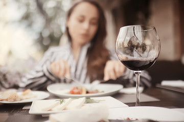 Obraz na płótnie Canvas red wine lunch girl cafe lifestyle, summer outdoor restaurant, mediterranean food