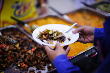 Food donation to the poor in human society : the concept of helping each other