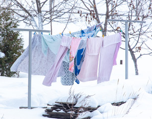 The clothes are dried on a rope in the winter
